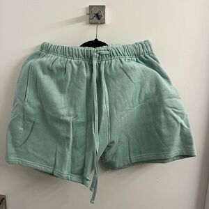 Teal shorts with drawstring in size L